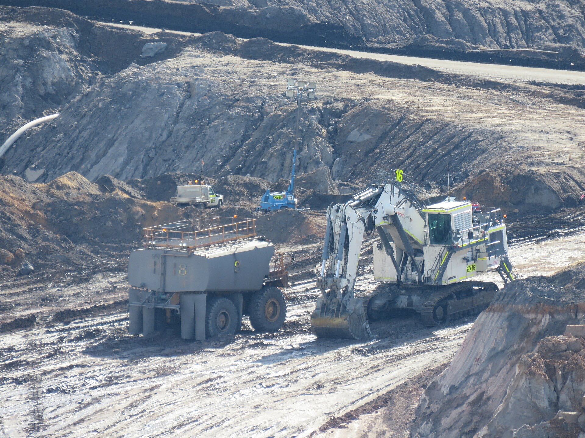 Excavator loading at an open pit